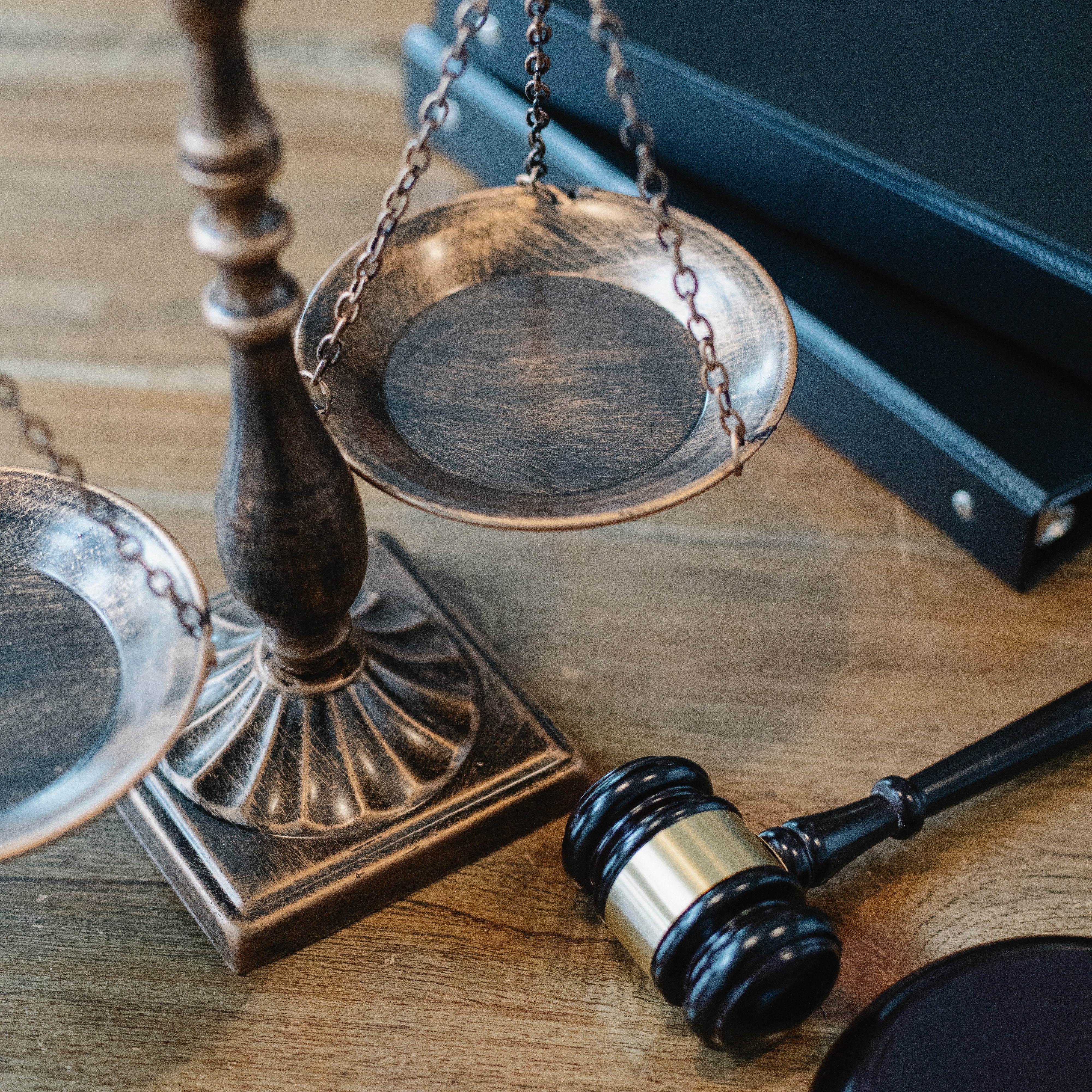 https://www.pexels.com/photo/justice-scales-and-gavel-on-wooden-surface-5668882/