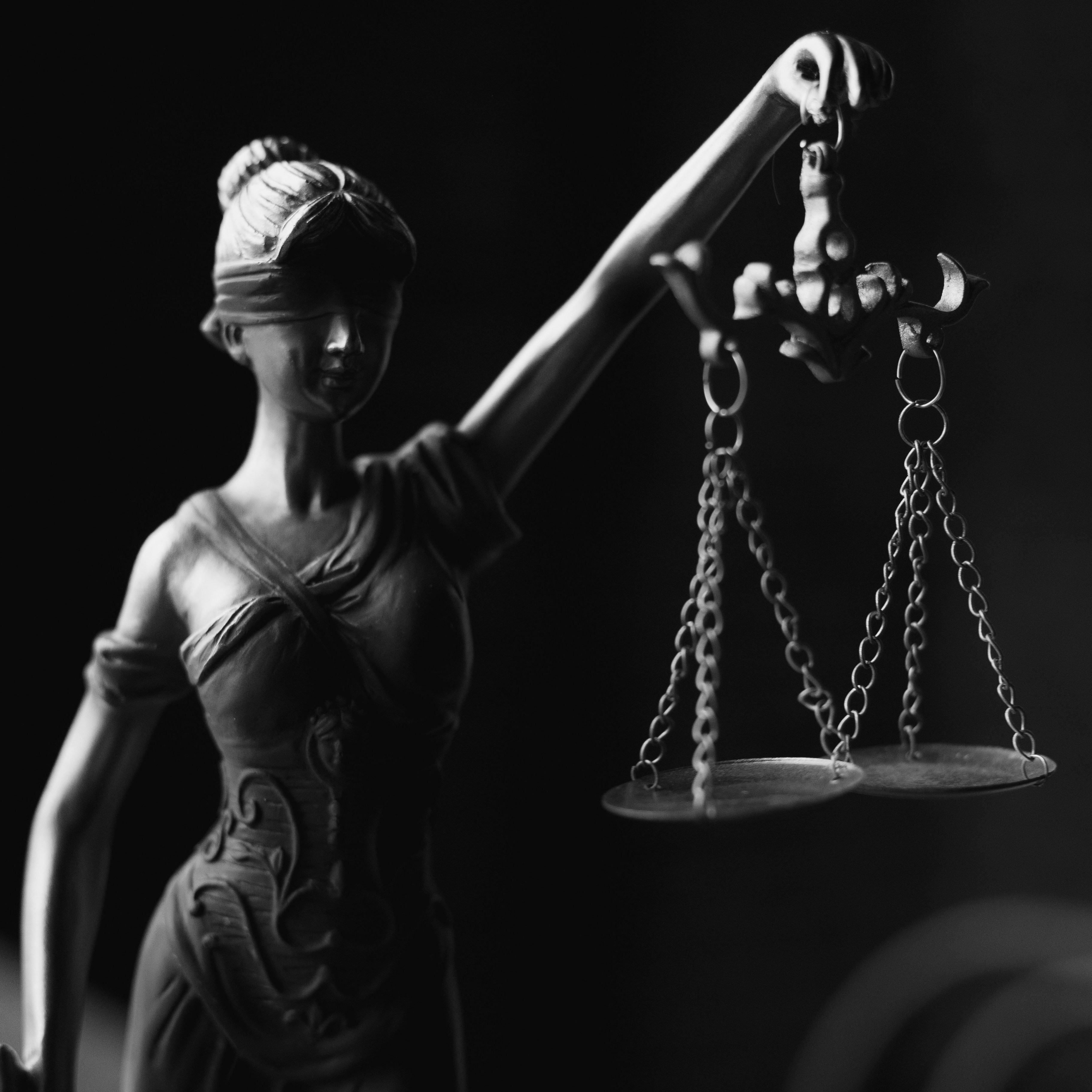 https://www.pexels.com/photo/a-grayscale-of-a-lady-justice-figurine-6077181/